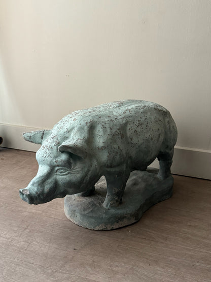 Light blue painted concrete pig