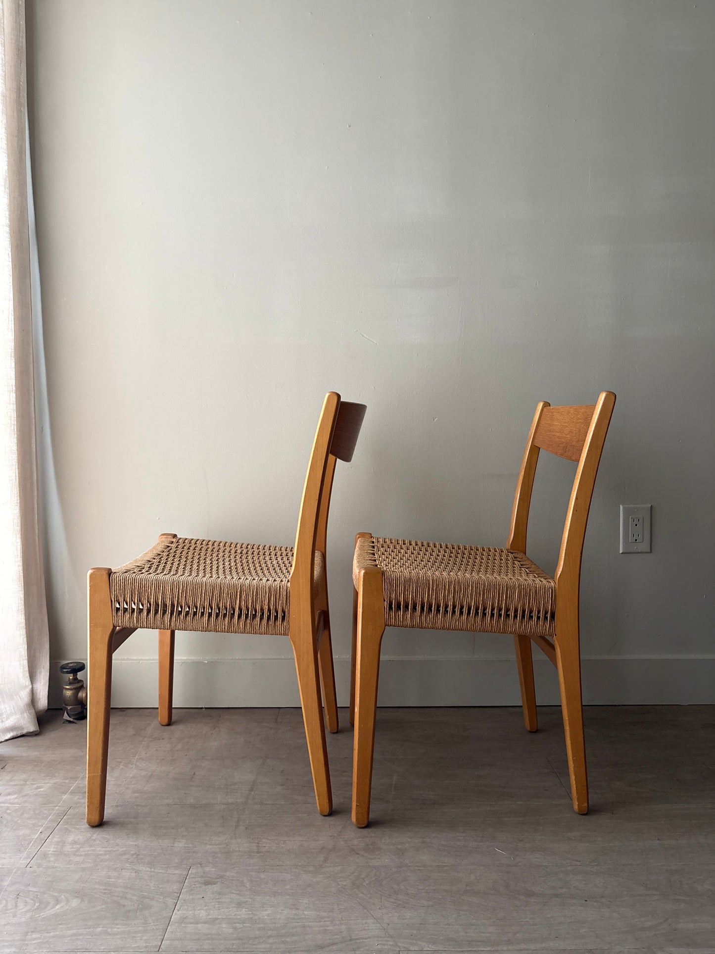 Swedish teak twisted rope seat dining chairs. Sold as a pair.