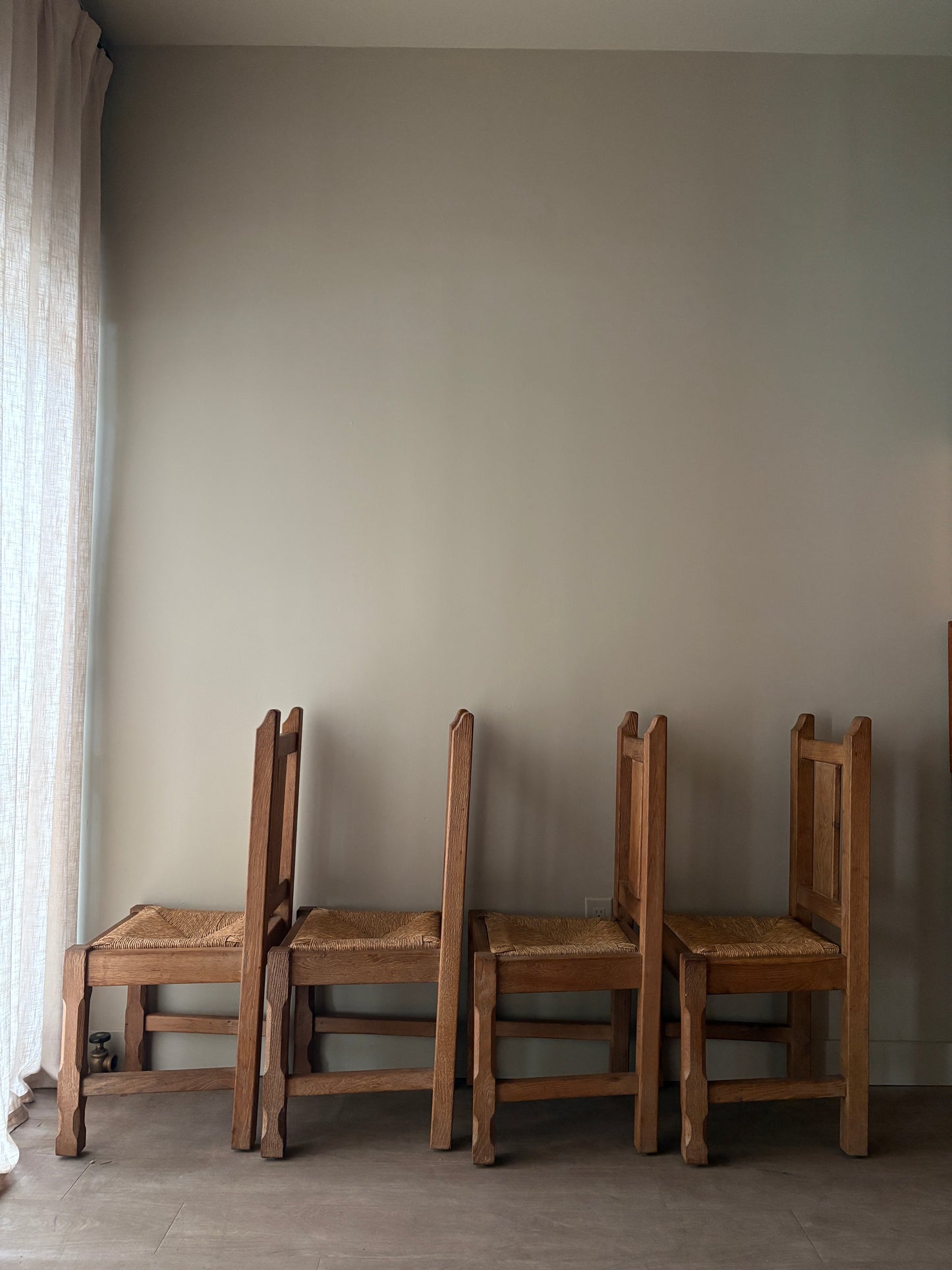 Belgian De Puydt oak & rush dining chairs. Sold in pairs.