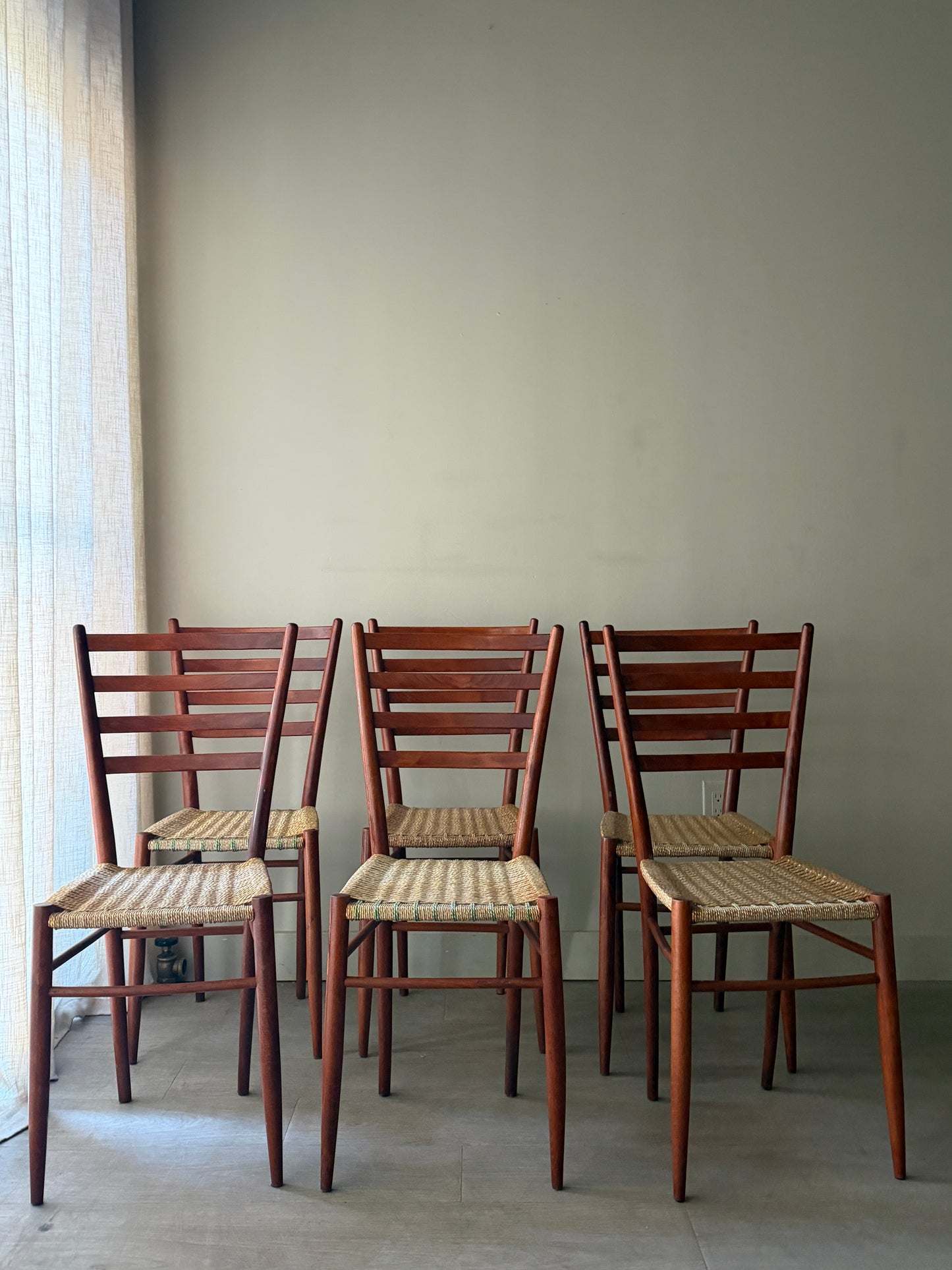 Chiavari Spinetto ladder back dining chairs with wicker cord seats. Sold as a set of 6.