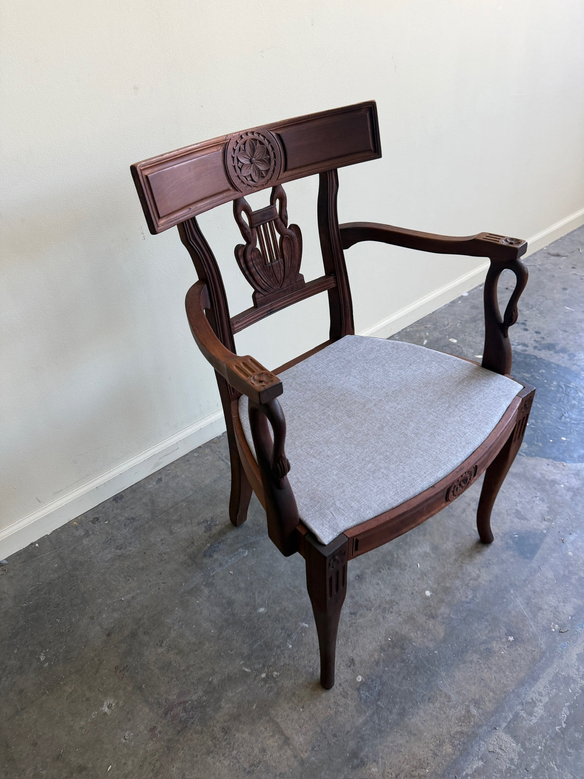 Carved mixed wood armchair