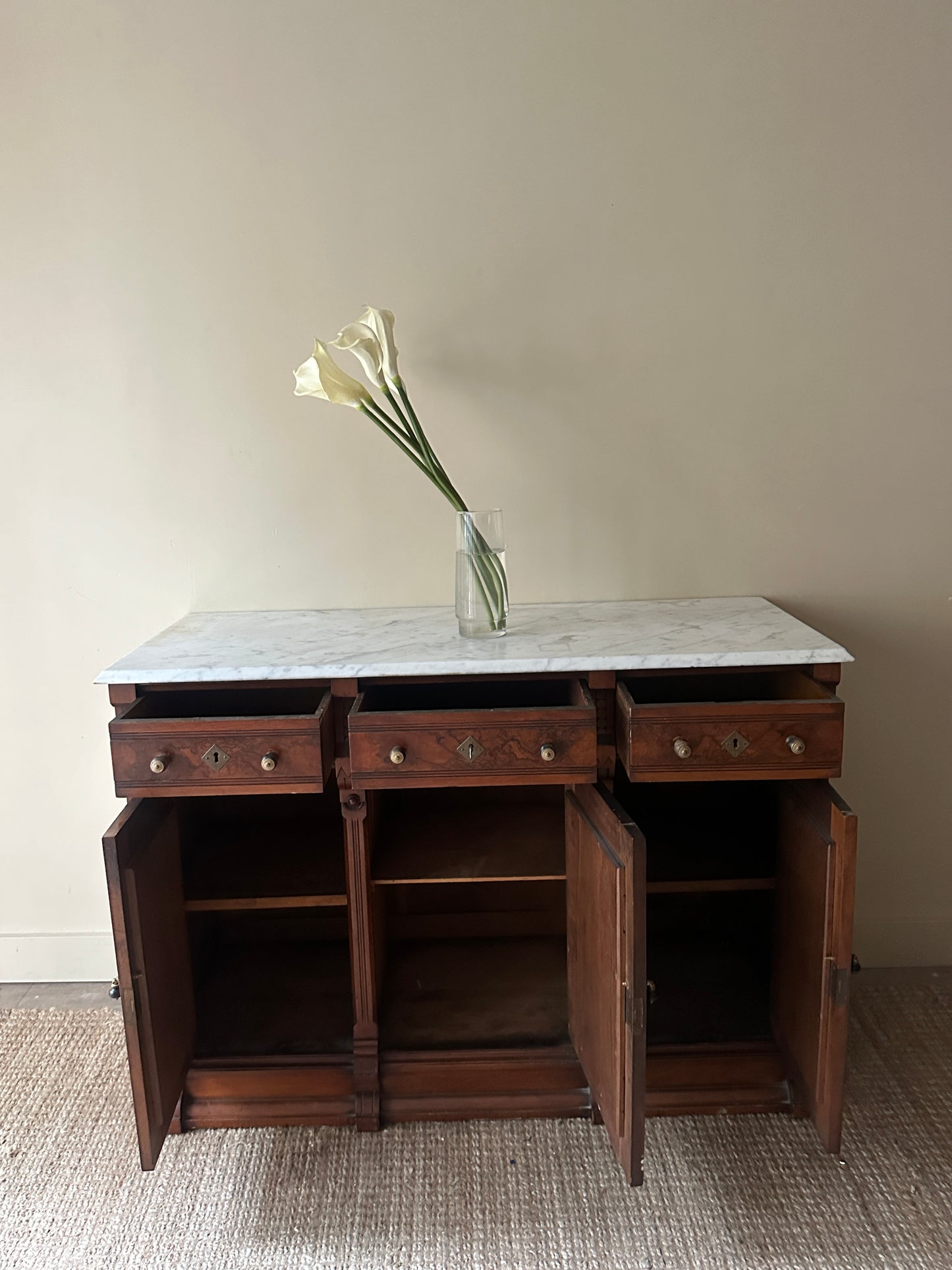 Carved walnut marble top sideboard