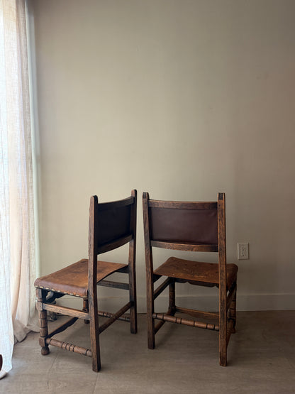 Spanish leather and oak chairs. Sold individually.
