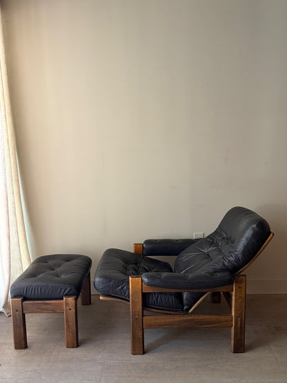 Reclining leather armchair with ottoman