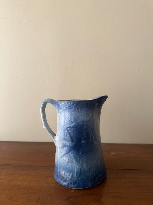 Salt glazed stoneware pitcher with birds and flowers