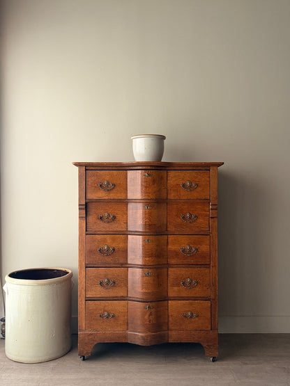 Oak serpentine tallboy dresser