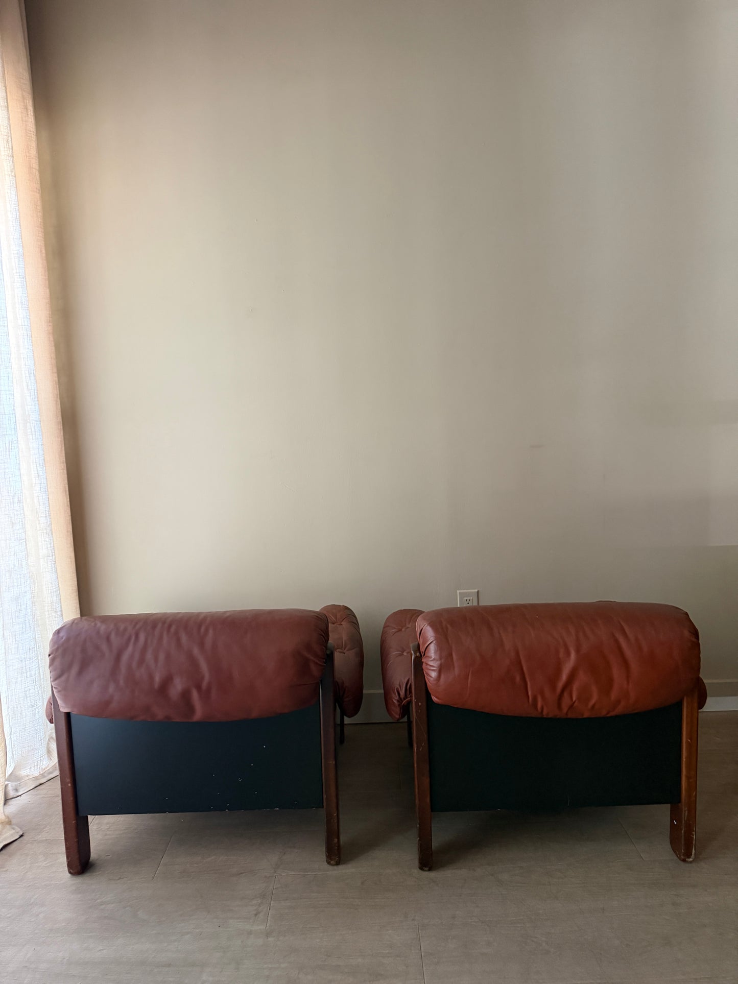 Swedish Brutalist brown leather lounge chairs. Sold individually.