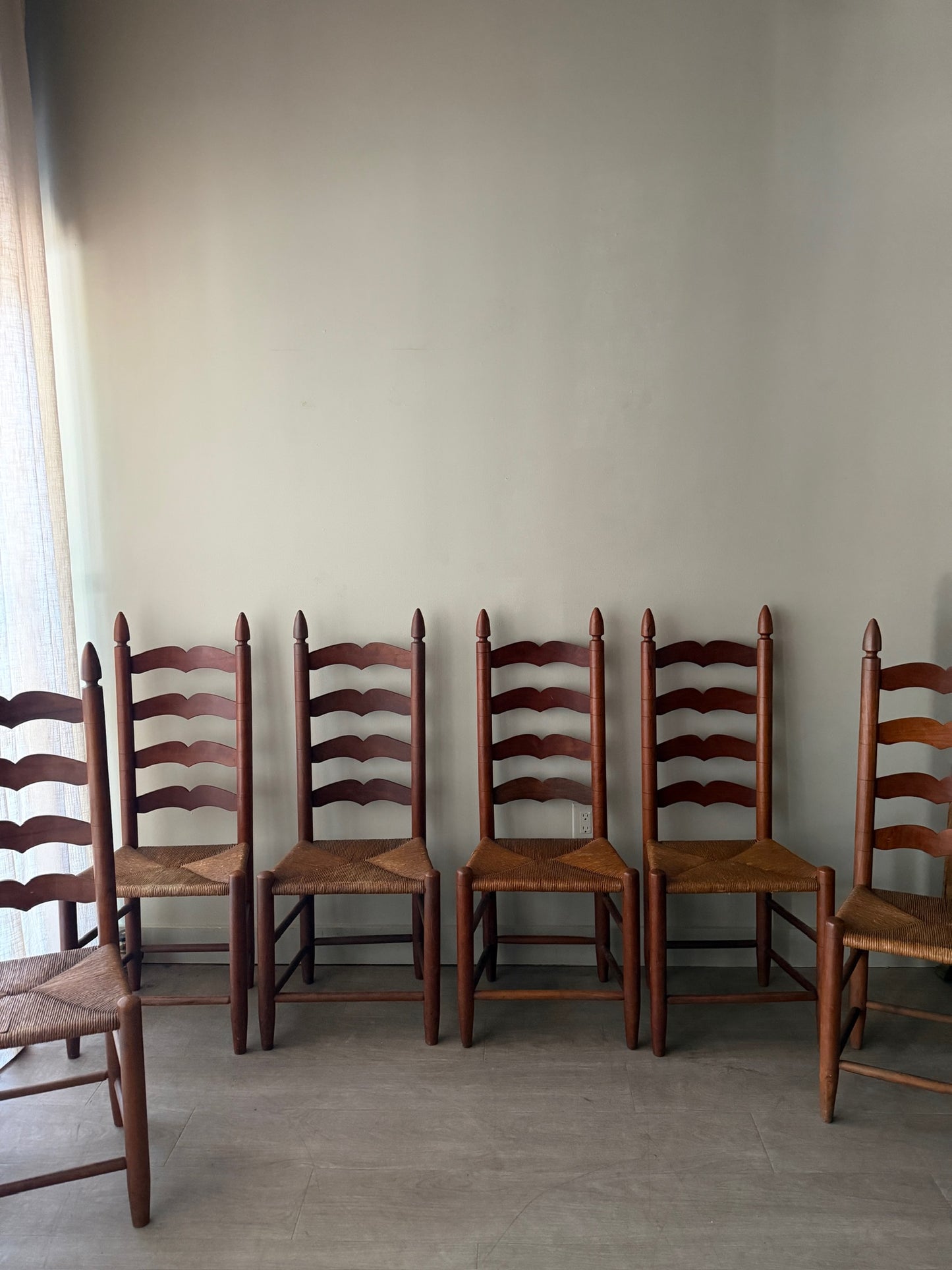 Cherry ladder back rush seat dining chairs. Sold in pairs.