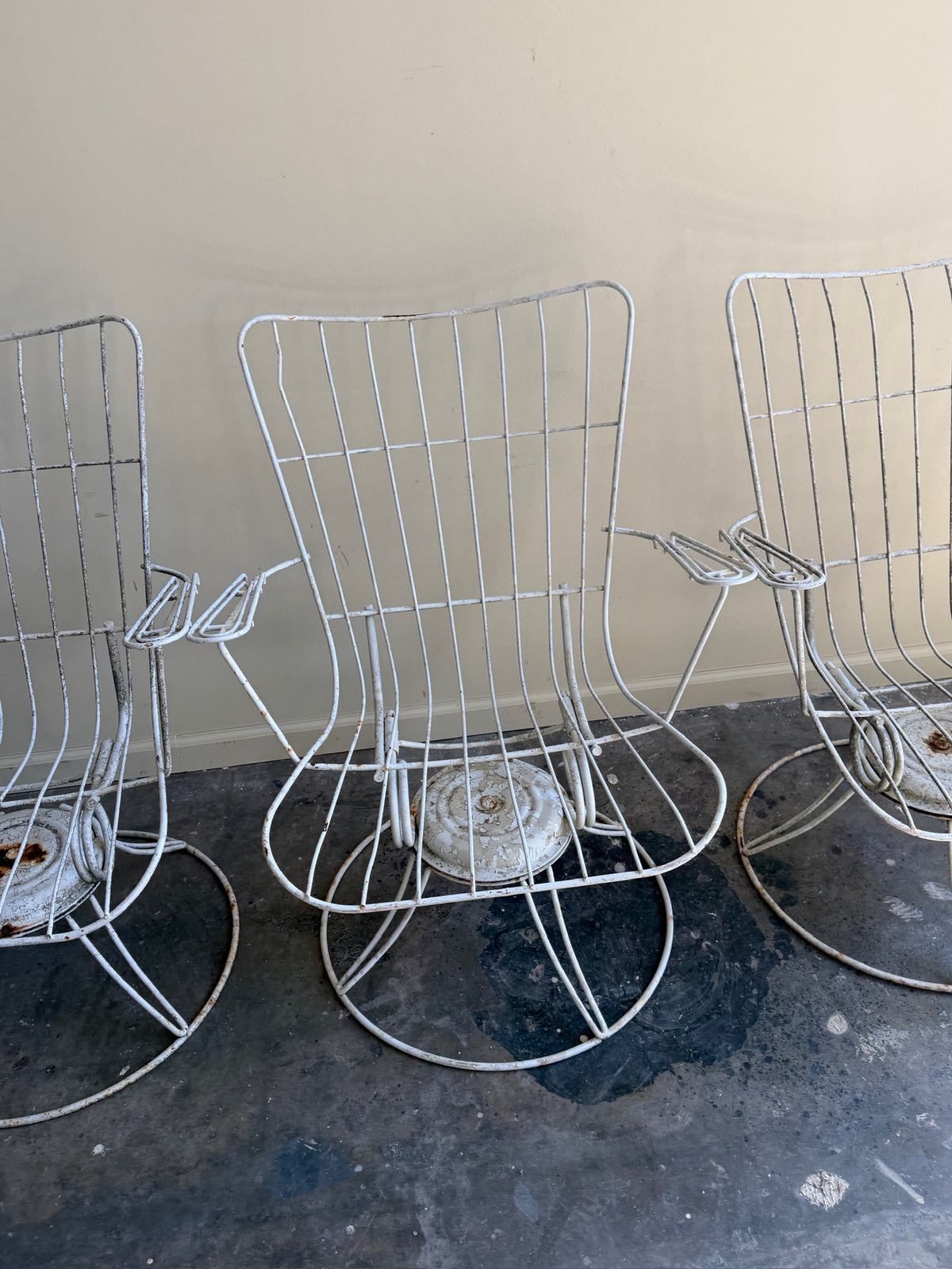 White swivel patio chairs. Sold individually.