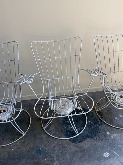 White swivel patio chairs. Sold individually.