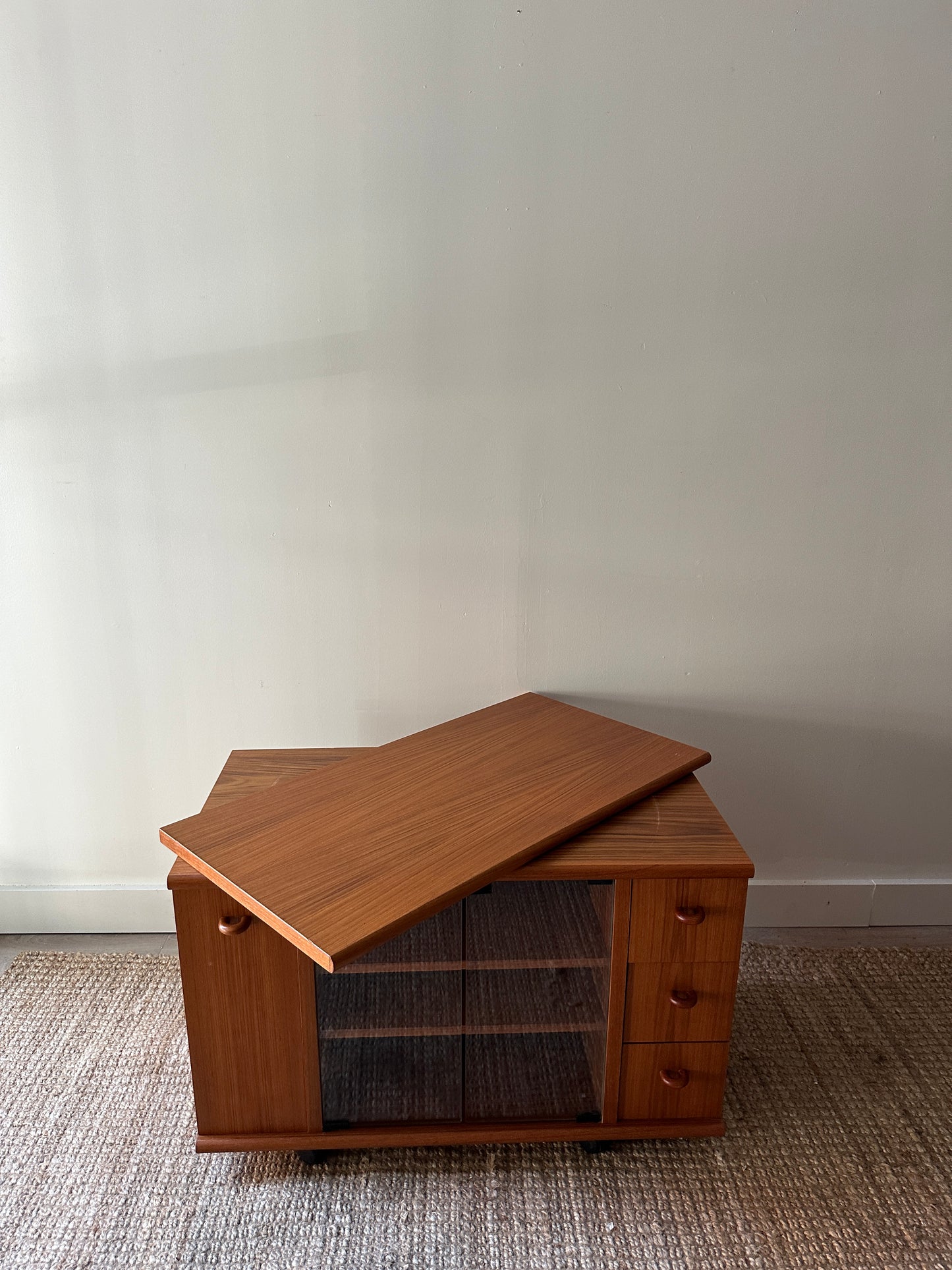 Teak swivel top media cabinet