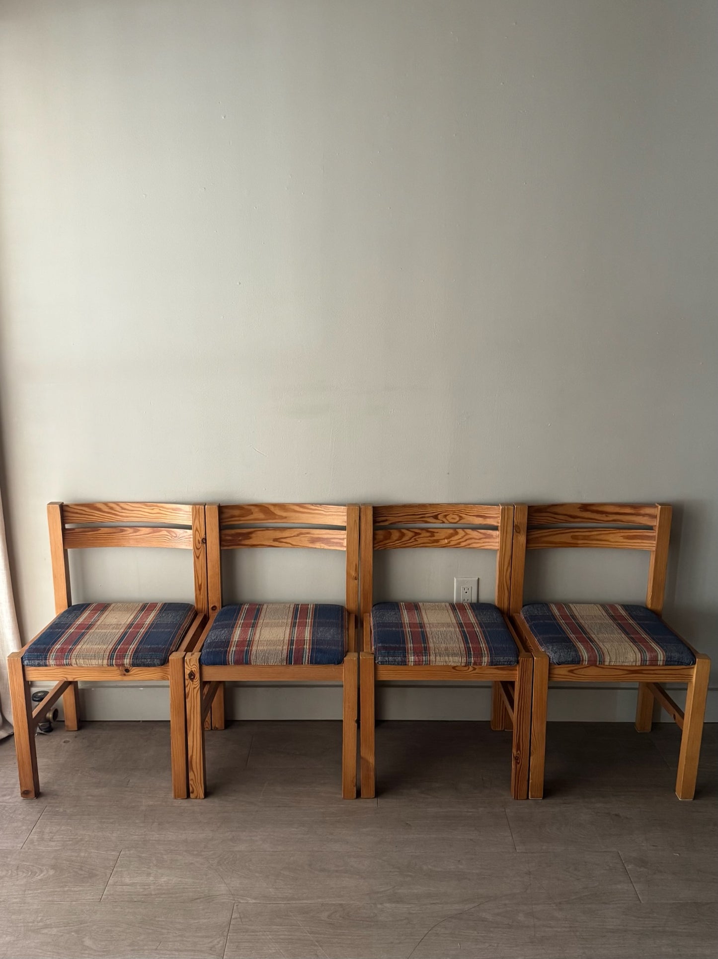 Danish pine plaid upholstered dining chairs. Sold in pairs.