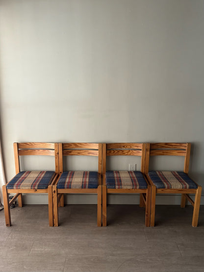 Danish pine plaid upholstered dining chairs. Sold in pairs.