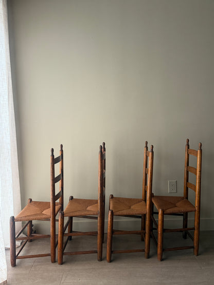 Pine ladder back rush seat chairs. Sold as a set of 4.