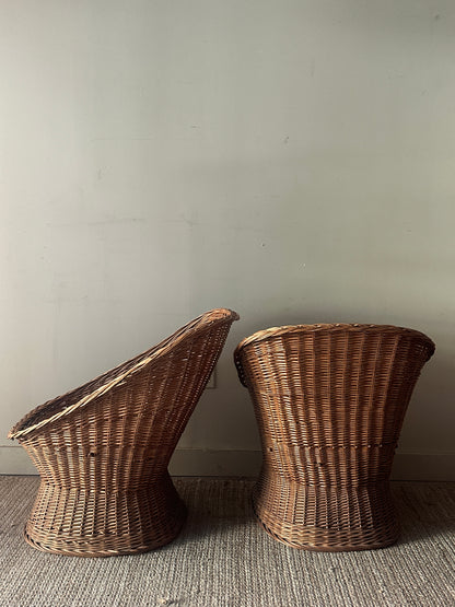 Wicker lounge chairs. Sold individually.