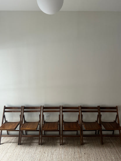 Oak folding chairs. Sold individually.