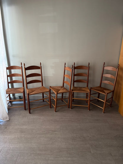 Cherry ladder back rush seat chairs. Sold individually.