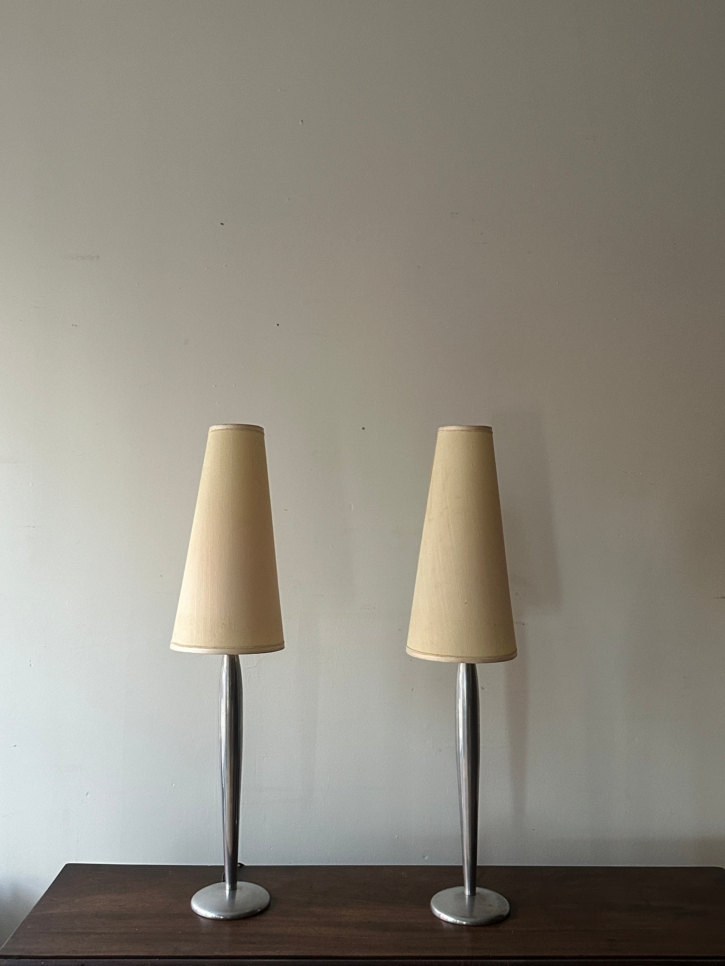 Lucien Gau Paris brushed crome table lamps. Sold as a pair.