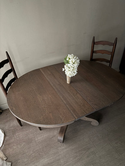 Golden oak dining table with extensions