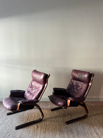 Danish bentwood leather lounge chairs. Sold individually.