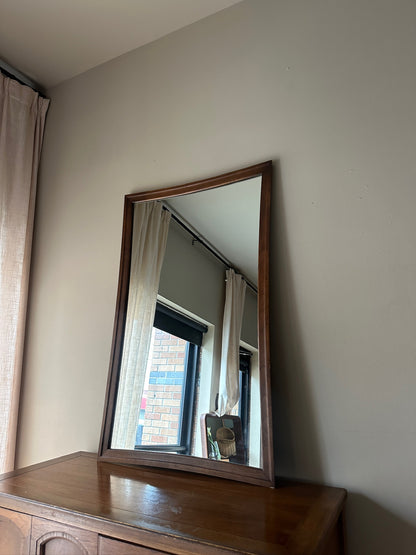 Serpentine walnut mirror