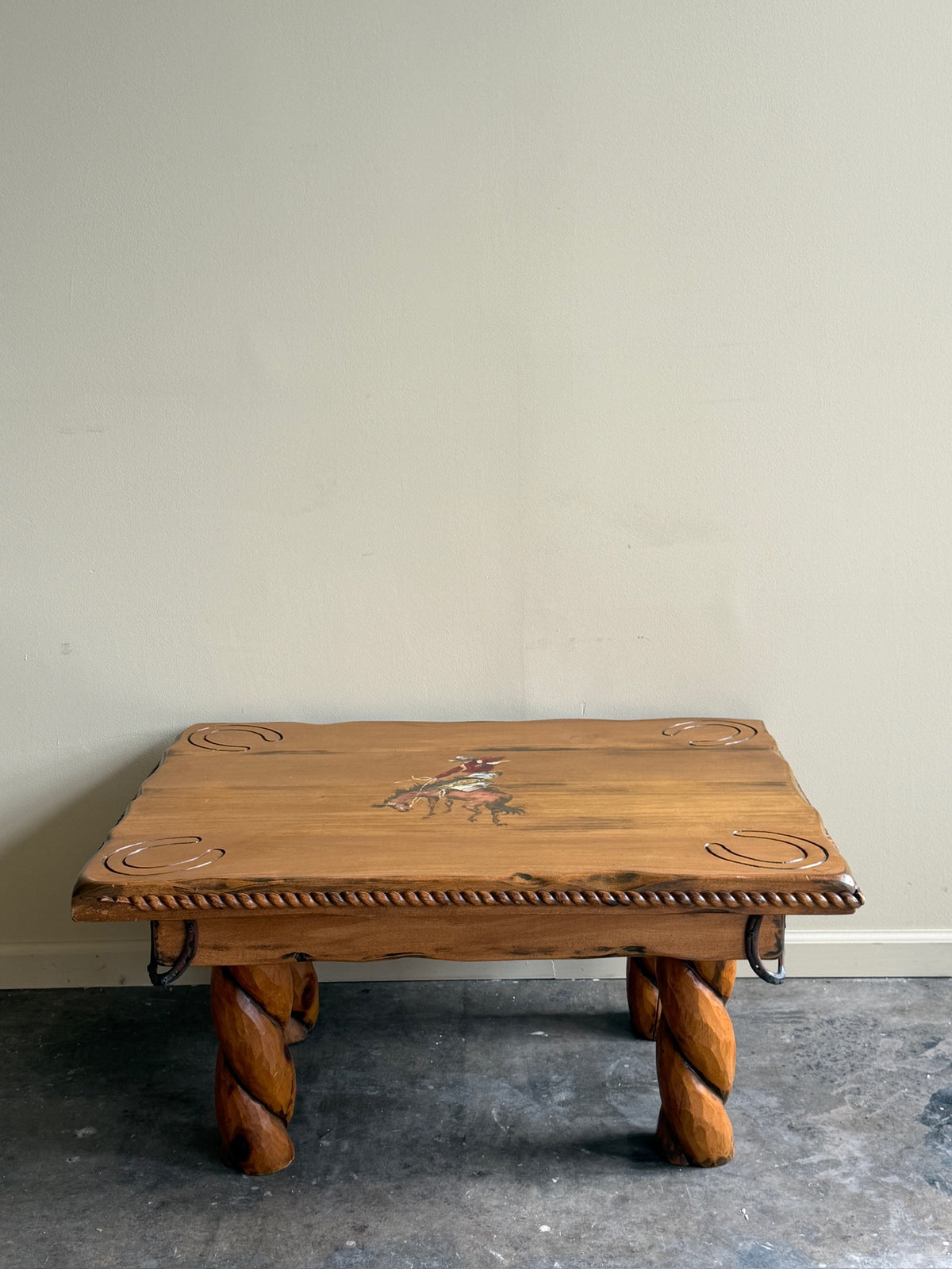Pine coffee table with equestrian motifs