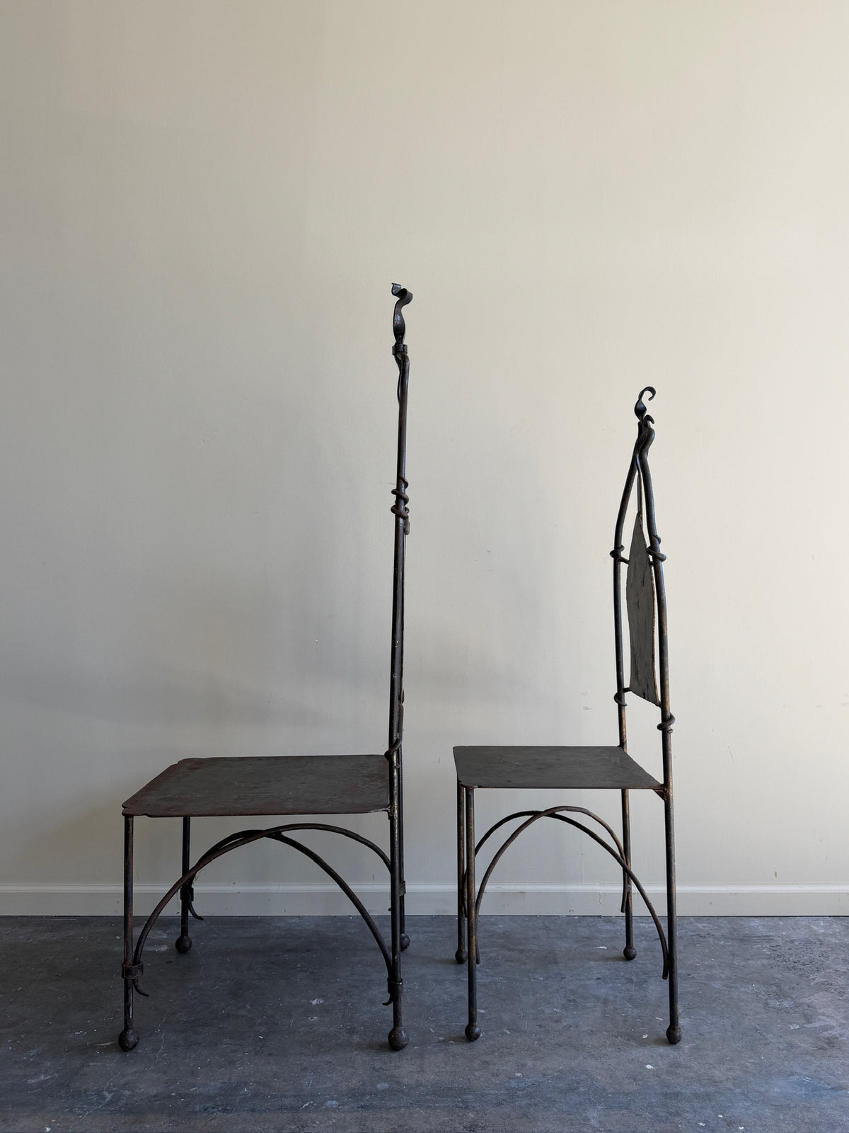 Wrought iron sculptural chairs (right)