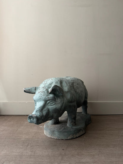 Light blue painted concrete pig