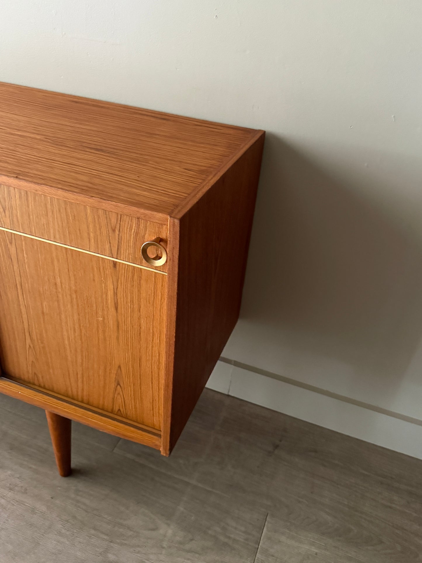 Danish teak sideboard with brass hardware