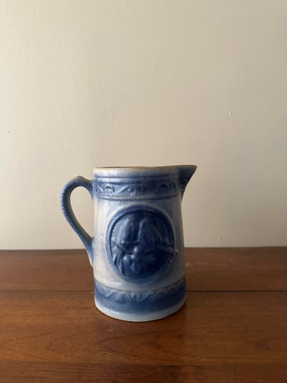 Salt glazed stoneware pitcher with birds