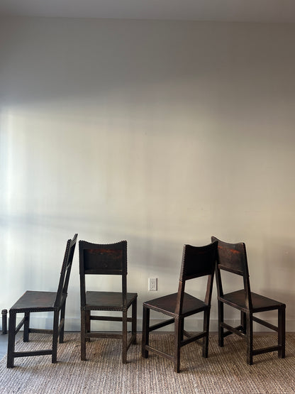 Leather and walnut nailhead dining chairs. Sold individually.