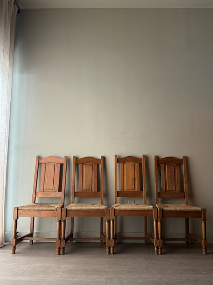 Dutch oak rush seat dining chairs. Sold in pairs.