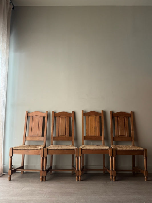 Dutch oak rush seat dining chairs. Sold in pairs.