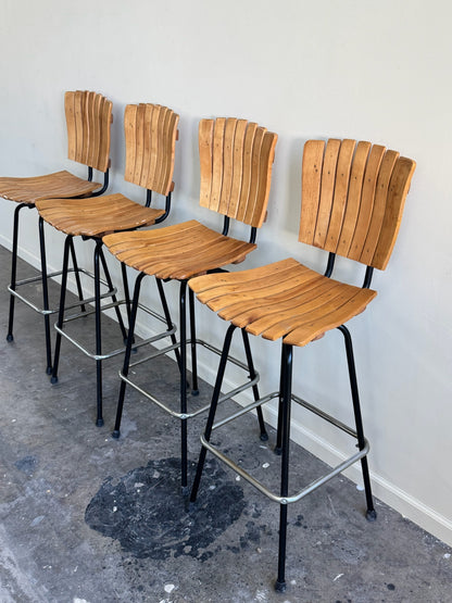 Slatted maple swivel bar stools. Sold in pairs.