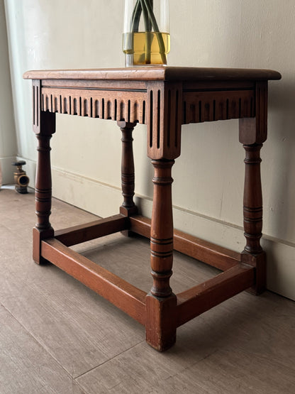 Walnut carved stool/side table
