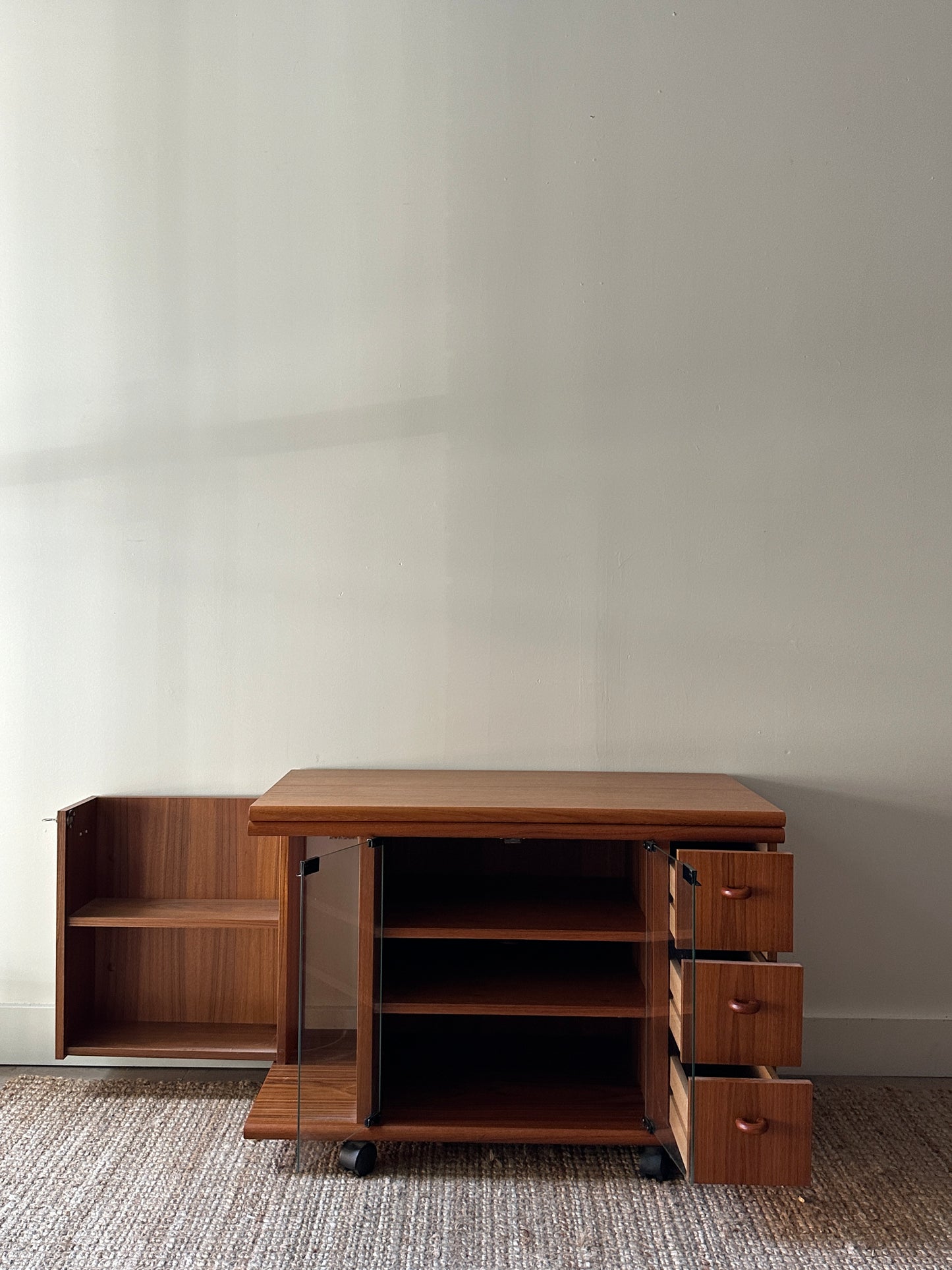 Teak swivel top media cabinet