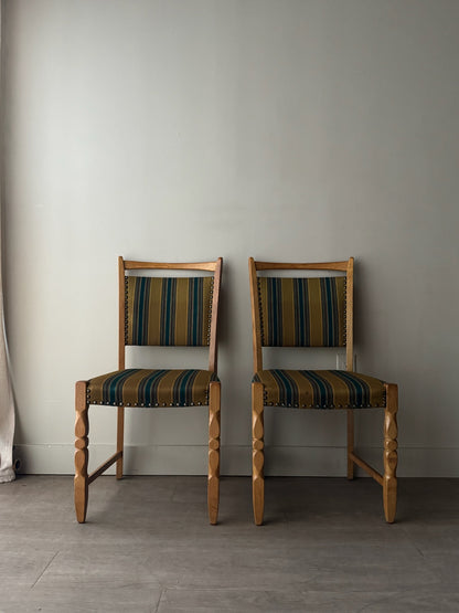 Danish oak dining chairs with striped upholstery. Sold in pairs.