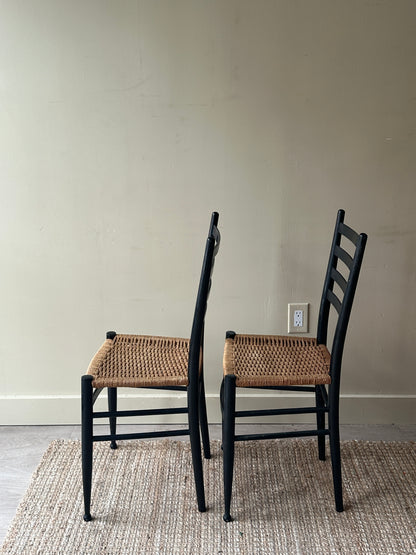 Pair of woven dining chairs. Sold as pair.