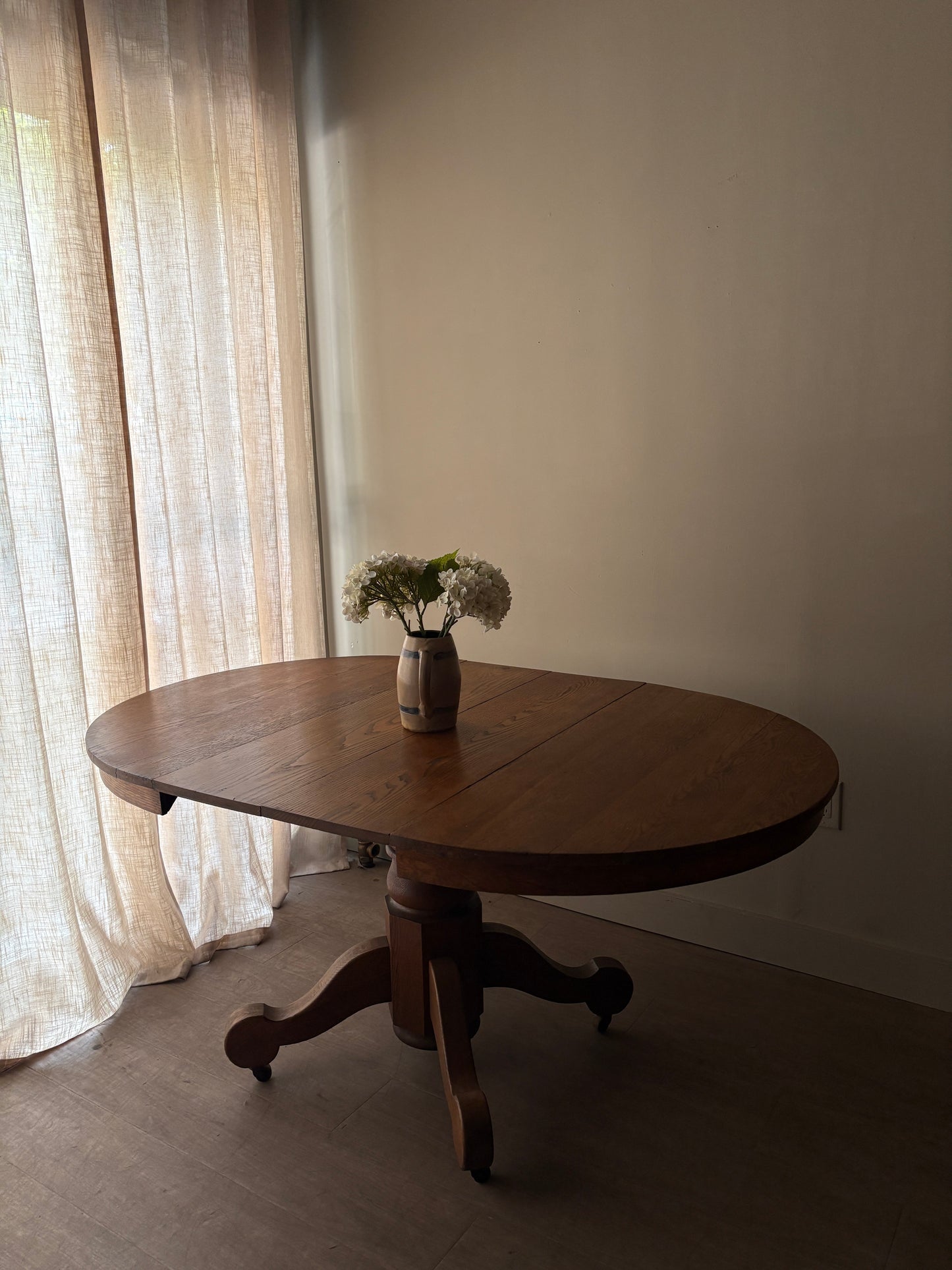 Oak dining table with extensions