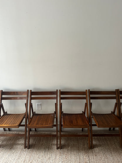 Oak folding chairs. Sold individually.