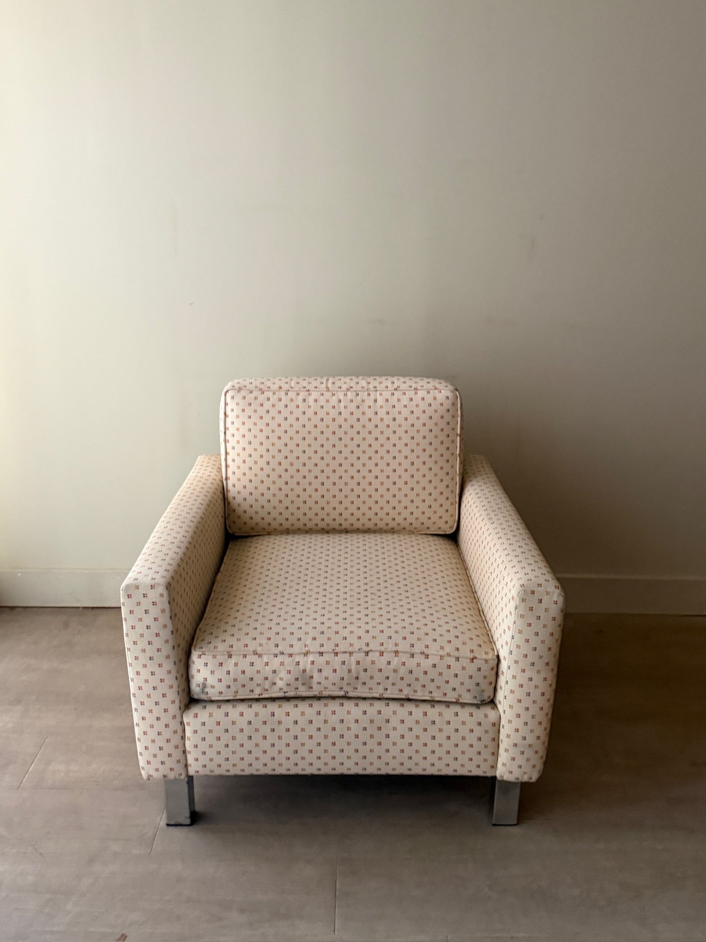 Upholstered chrome armchair