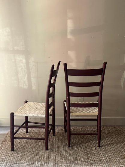 Armless woven chairs. Sold as a pair.