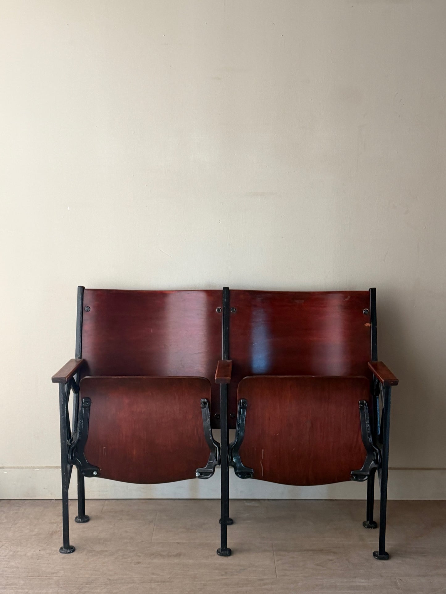 Cast iron and bentwood two-seat folding theater bench