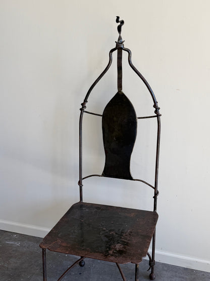 Wrought iron sculptural chairs (left)