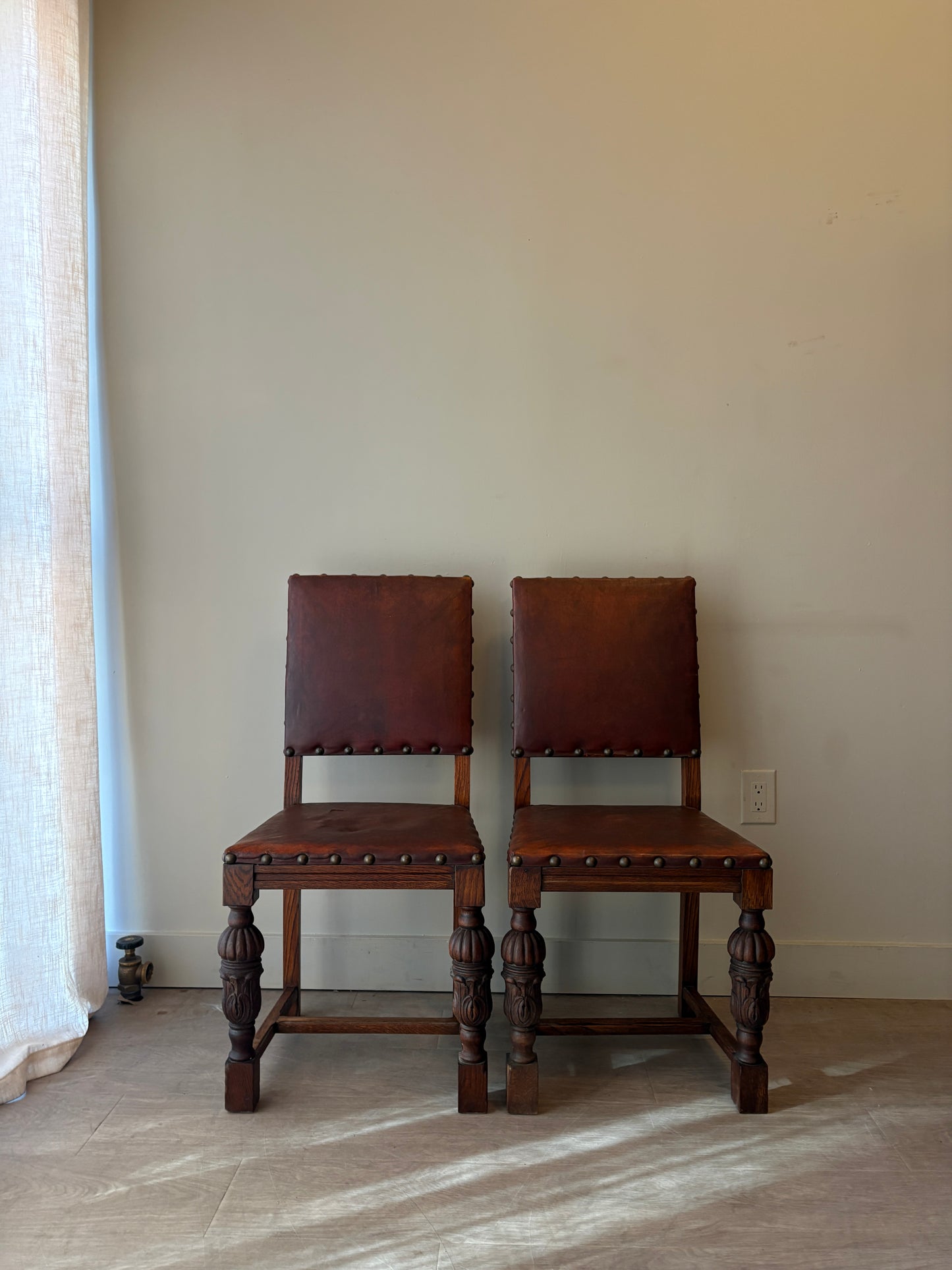 Leather and oak dining chairs with rips. Set of 2.