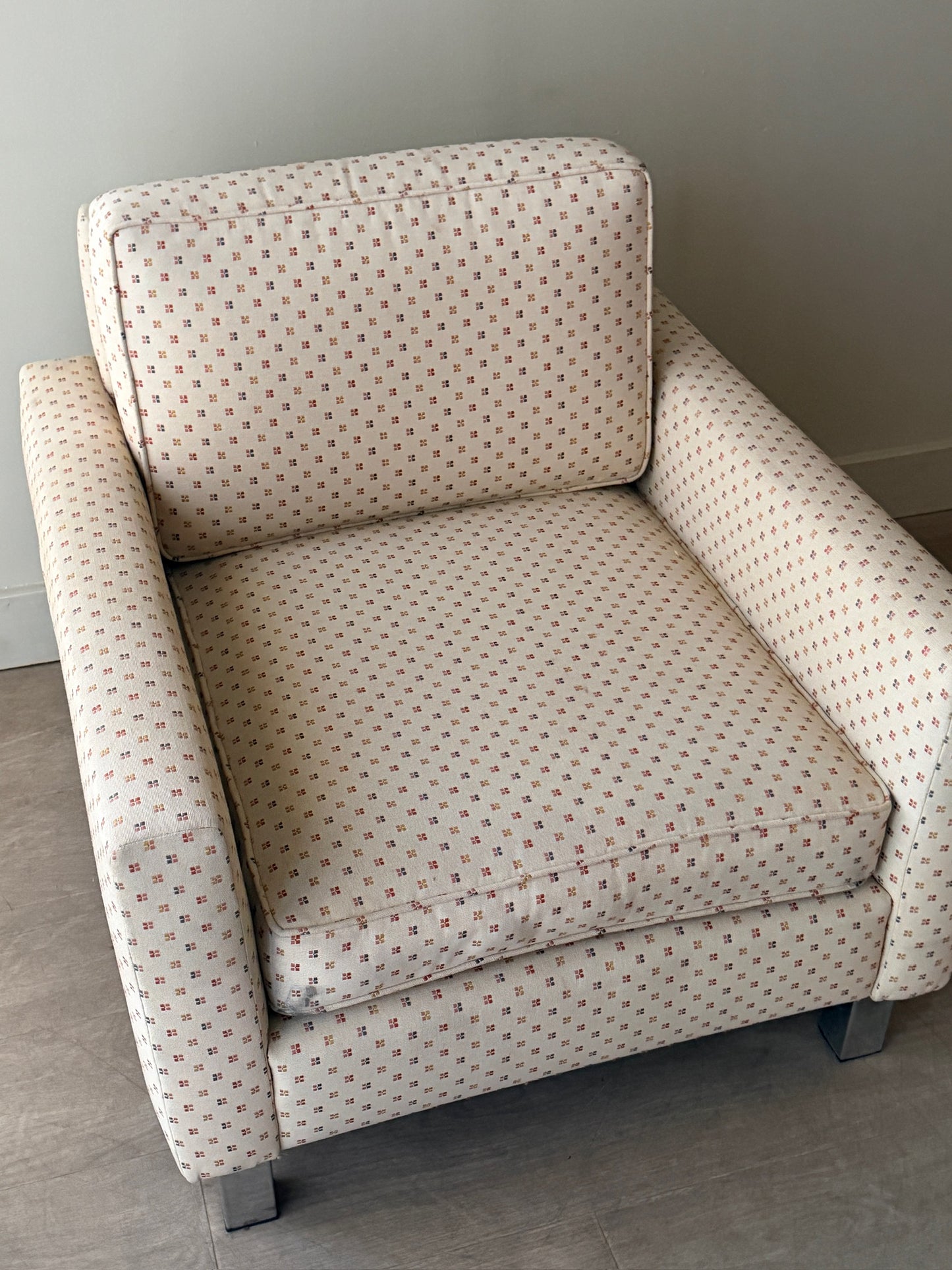 Upholstered chrome armchair