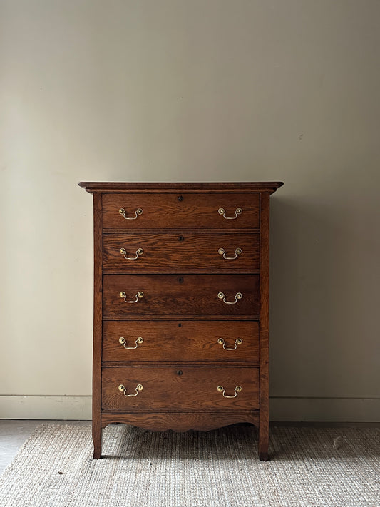 Oak tallboy with brass handles