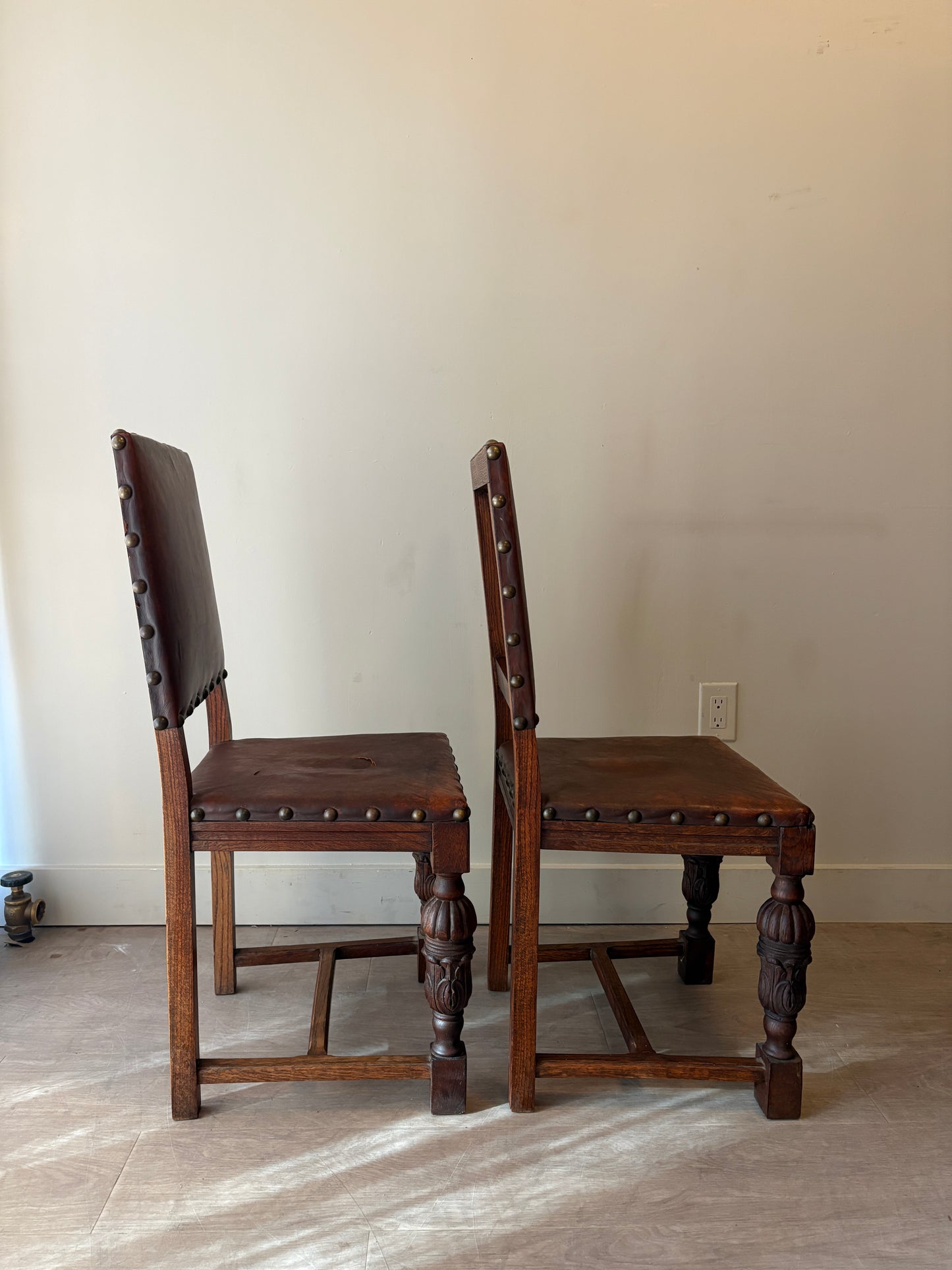 Leather and oak dining chairs with rips. Set of 2.