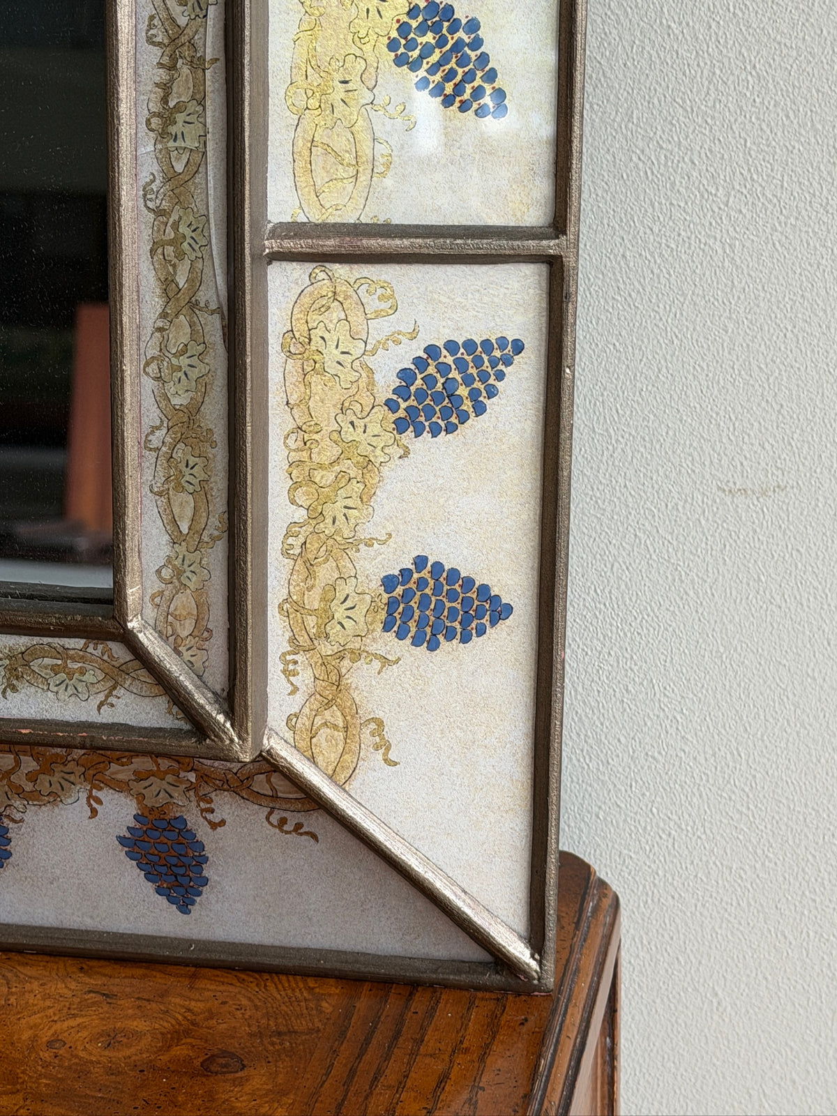 Reverse painted glass mirror