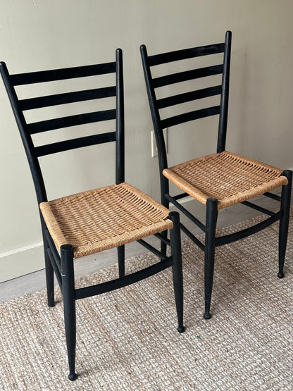 Pair of woven dining chairs. Sold as pair.